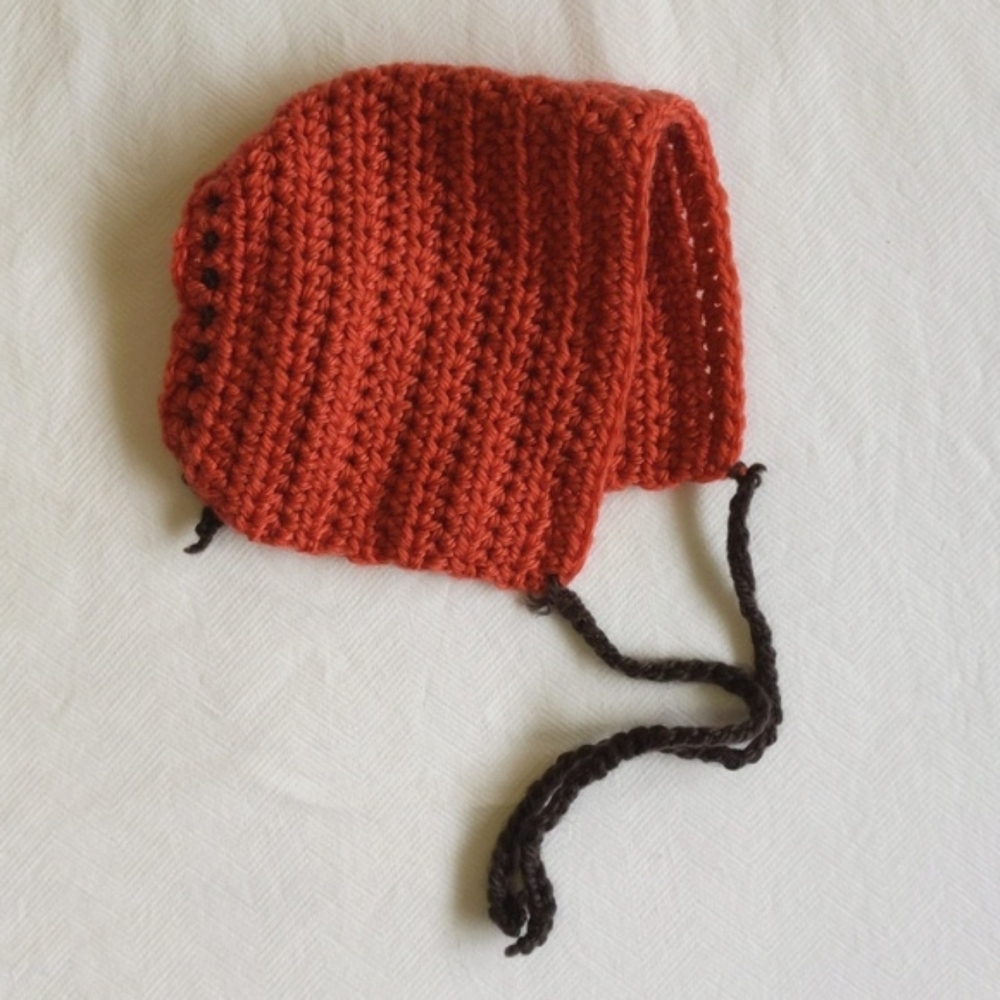 handmade burnt orange knit baby infant bonnet with adjustable back unisex